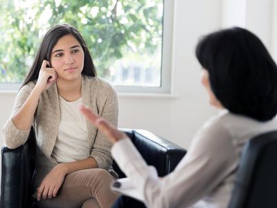 teenage girl (16-17) talking to therapist