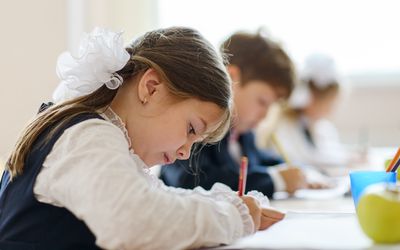 young students writing