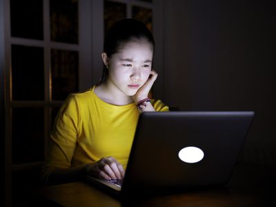 Girl on computer at night