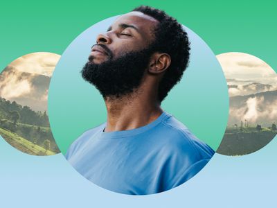 Man meditating against a mountainous backdrop