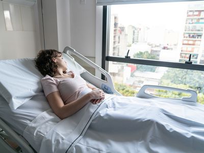 Woman in hospital bed