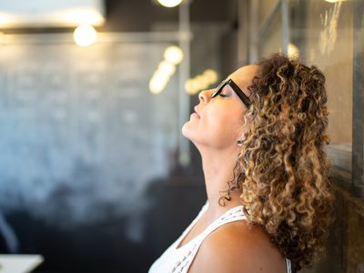 stressed person at work with glasses on