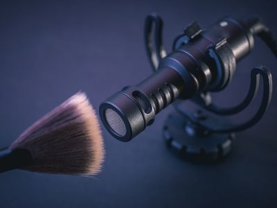 ASMR concept - microphone and makeup brush