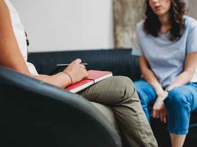 Psychotherapy session, woman talking to his psychologist in the studio