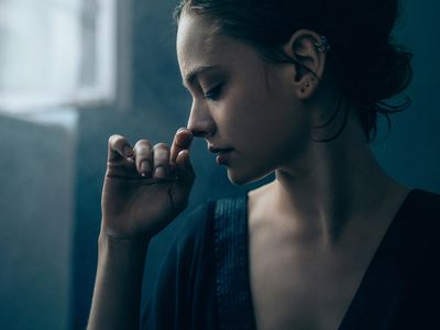 Portrait of young person posing in studio.