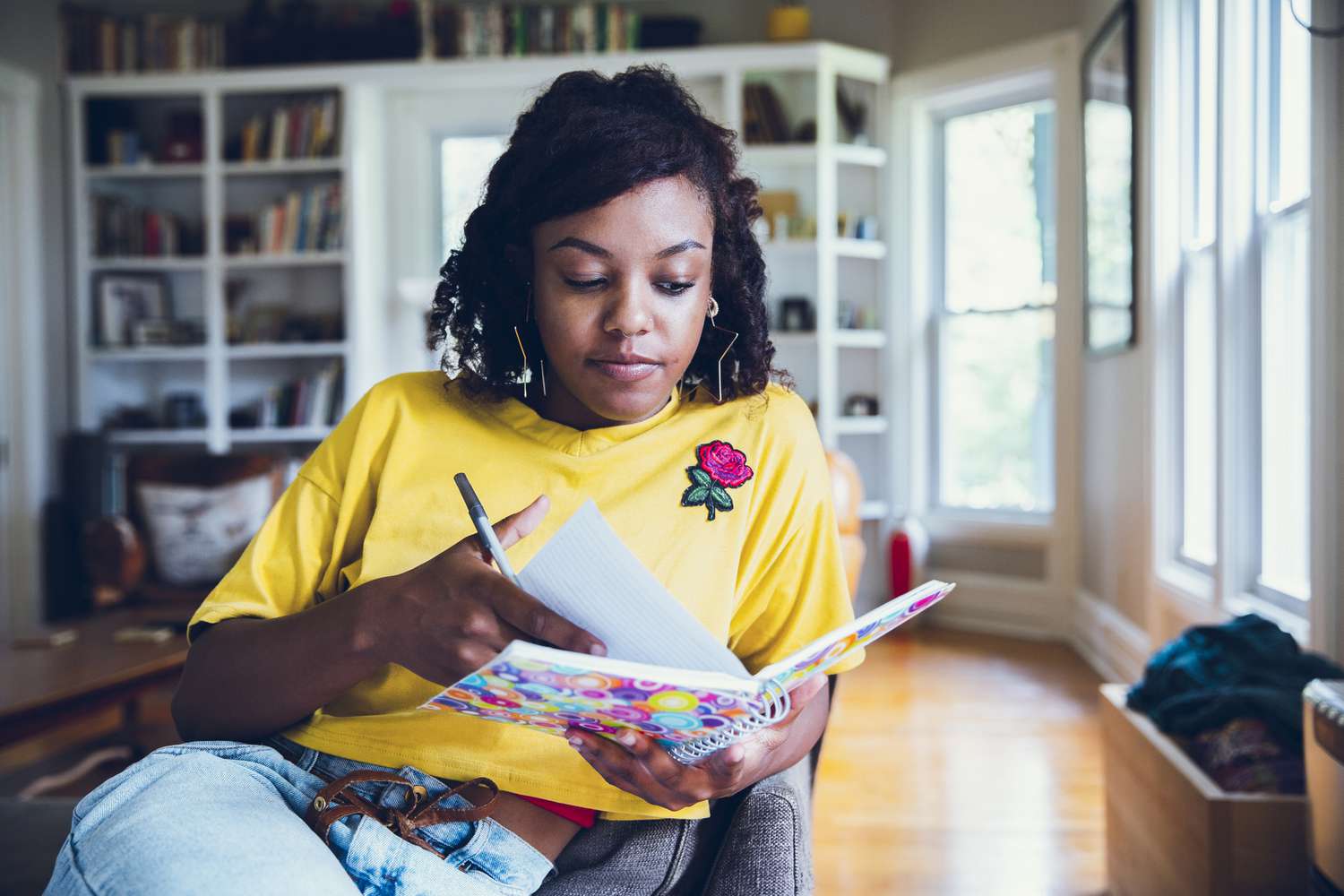 woman writing in a notebook