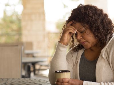 African American middle age woman looking sad.