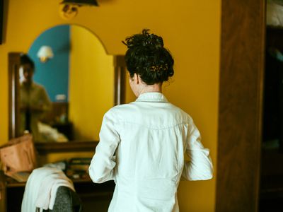 Woman changing in front of mirror