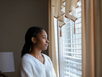 Woman looking out of window