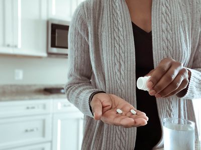 a woman taking medication 