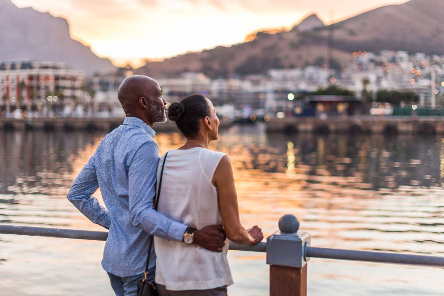 Couple on vacation looking at the sunset