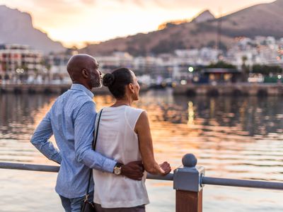 Couple on vacation looking at the sunset