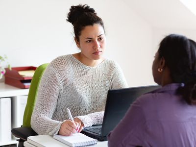 woman talking to social worker