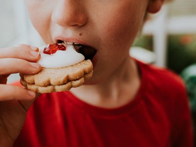 Boy Eating a German Biscuit 