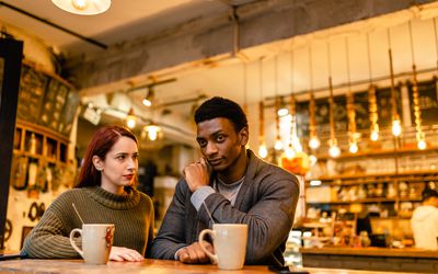 young couple talking through a conflict