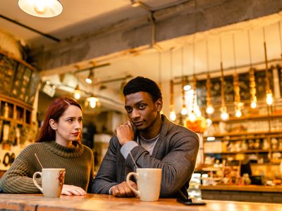 young couple talking through a conflict