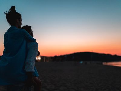 couple at the beach watching the sunset