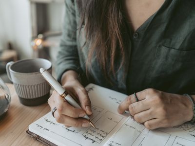 Woman taking notes in her diary