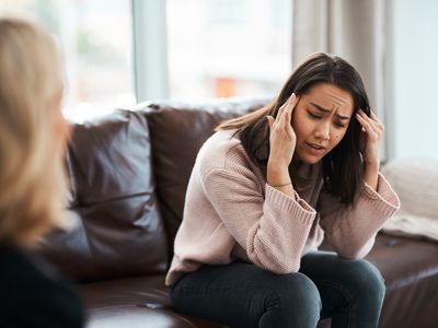 Shot of a young woman having a therapeutic session with a psychologist