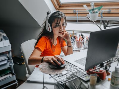 person listening to music while doing work