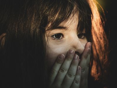 A young girl showing shock or surprise