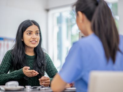 south asian woman talking to their therapist