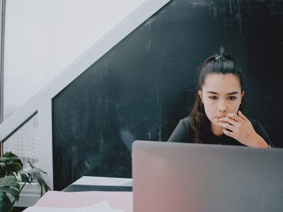 teenager hispanic woman attending online class at home