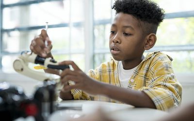 young boy in school classroom