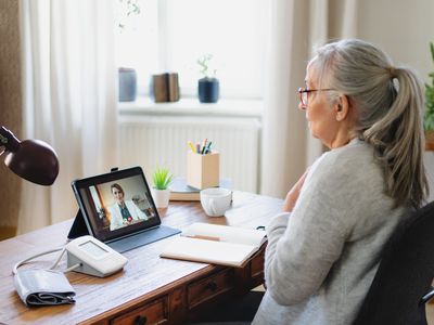 Online consultation with healthcare worker, lockdown concept.