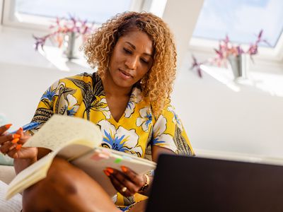 person writing in a journal