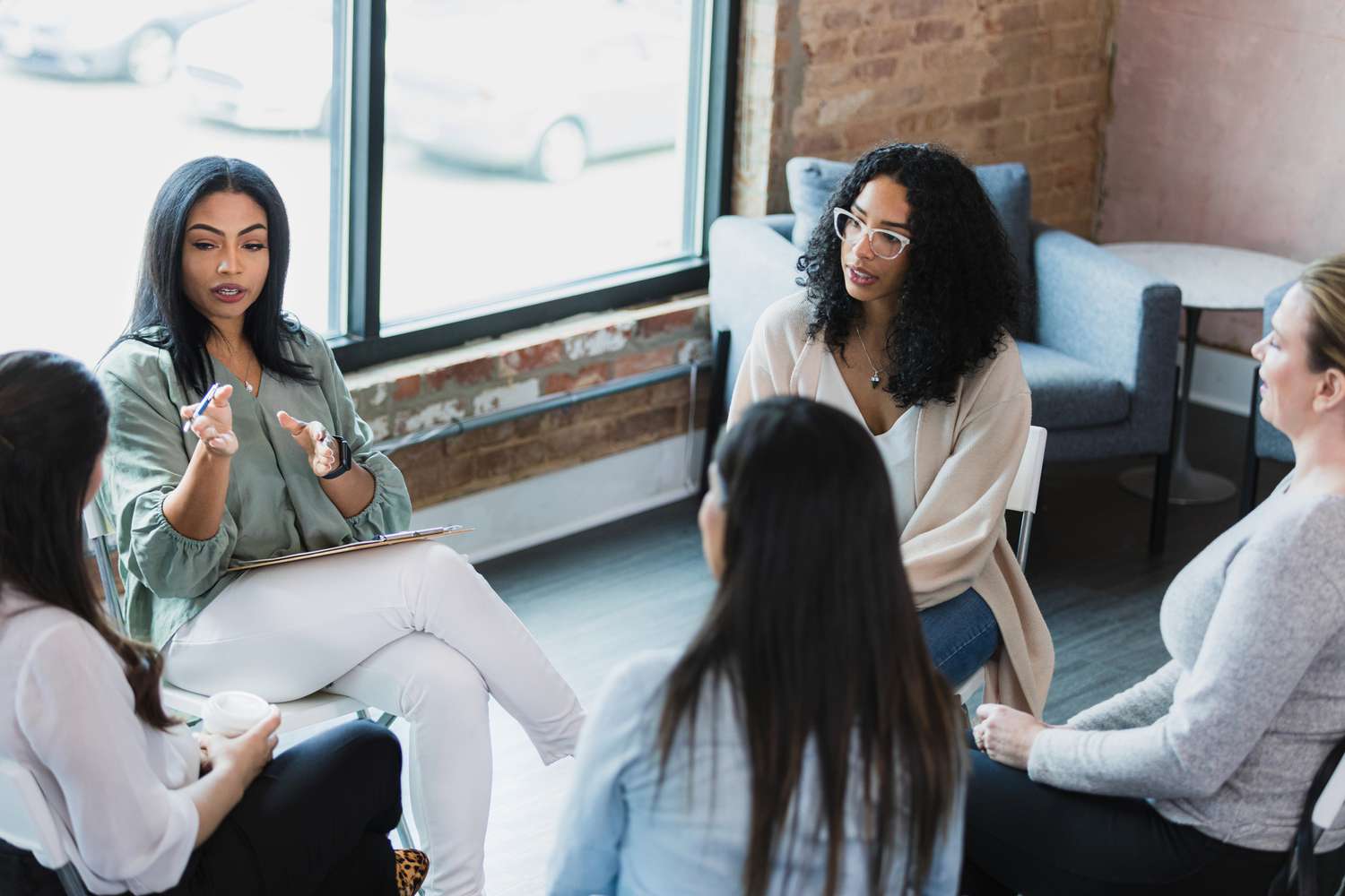 group therapy with a diverse group of people sitting in a circle