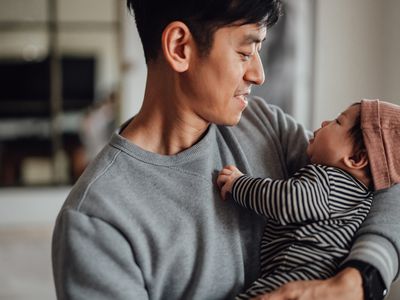 person holding their baby in arms