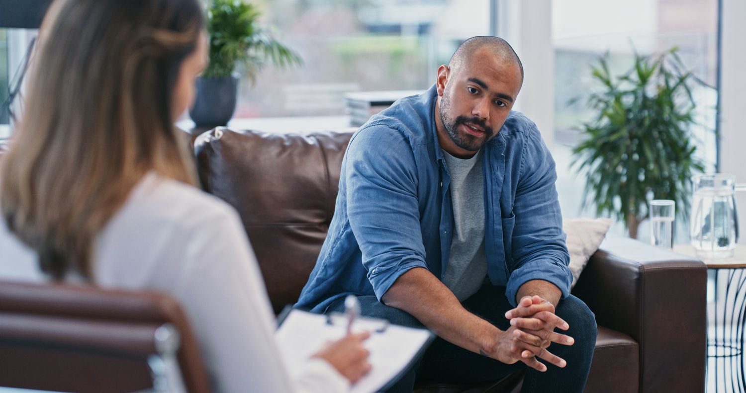 male patient talking to his therapist