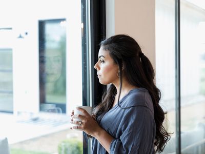 person looking out the window