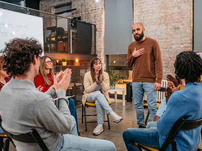 Man talking to the other members of the therapy group