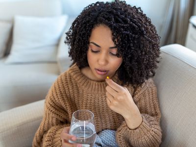 woman taking vitamins