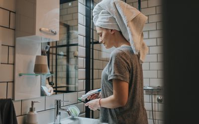 Woman night routine in bathroom 