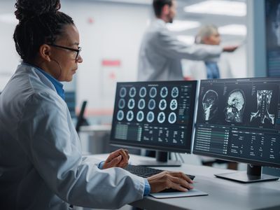 Medical Hospital Research Lab: Black Female Neuroscientist Using Computer with Brain Scan MRI Images, Finding Best Treatment for Sick Patient. Health Care Neurologist Analysing CT Scan. Arc Portrait