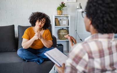 person on the couch talking to their therapist