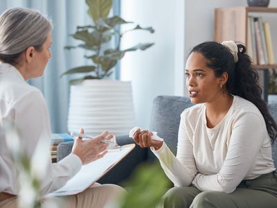 client with their therapist taking notes during the session