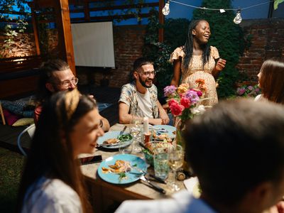 Friends and family having garden dinner party in the summer