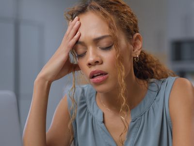 person stressed and sad at desk