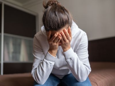 Depressed Woman Covered Her Face With Both Hands