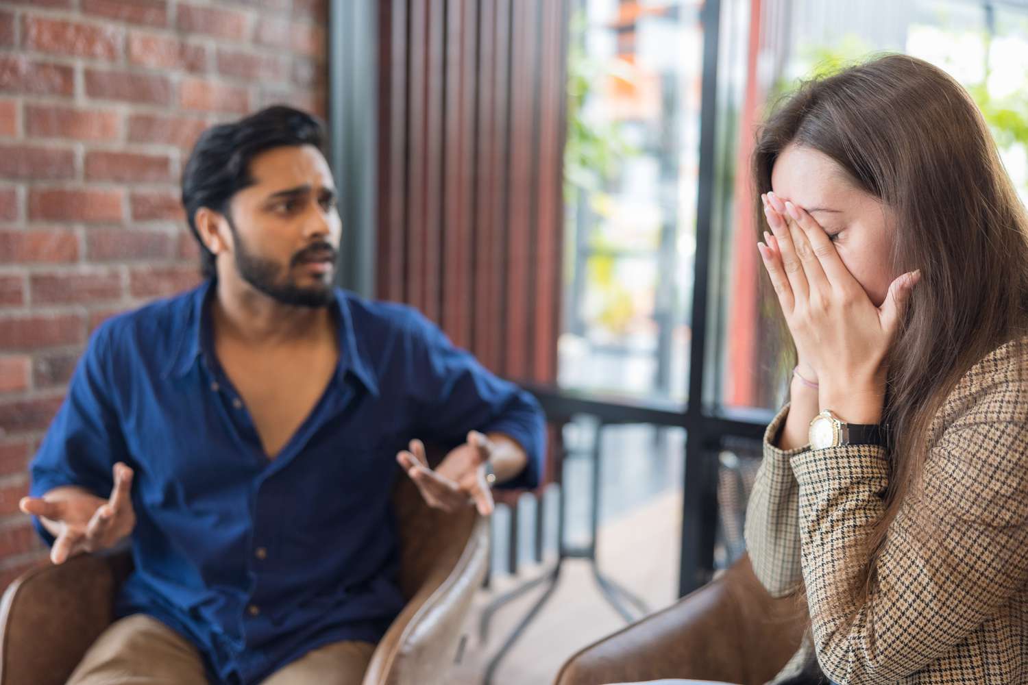 Young couple arguing while having problems in their relationship.