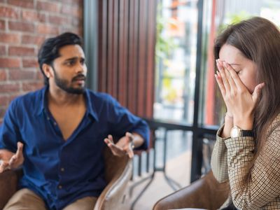 Young couple arguing while having problems in their relationship.