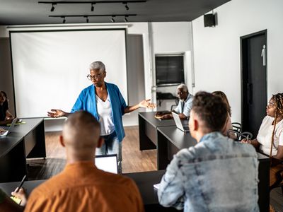 Senior woman teaching in a classroom or seminar