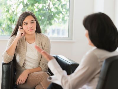 a teen in a counseling session with a therapist