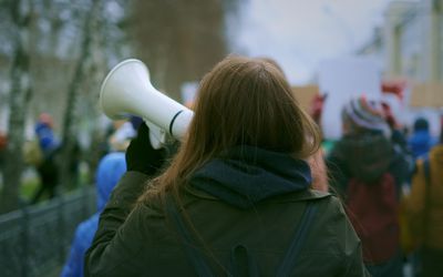 Young woman at demonstration in the city.