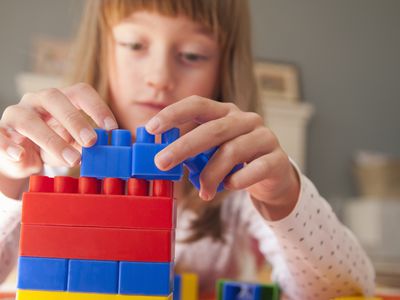 Girl stacking blocks