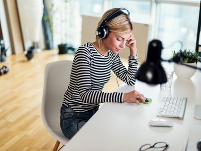 Woman listening to a podcast